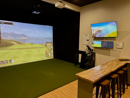Indoor golf simulator suite at Another Nine
